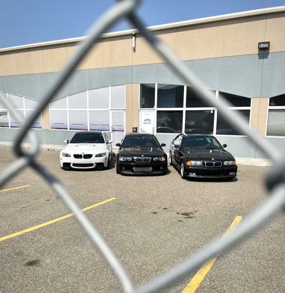 BMW M3 against a chainlink fence